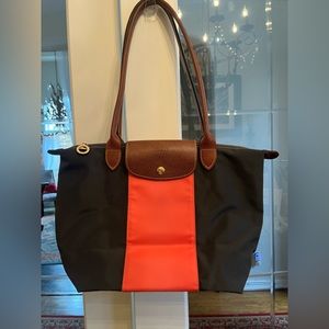 Longchamp Le Pilage black/ orange tote with brown interior. Clean nylon